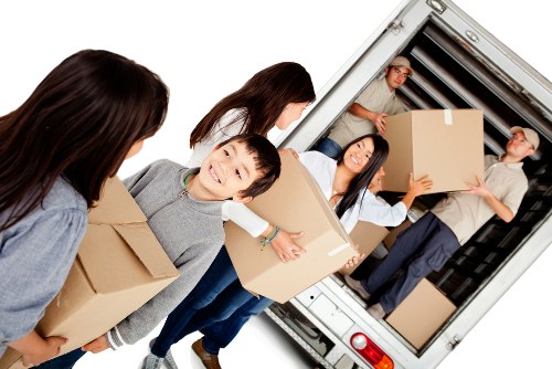 Removal team preparing boxes and furniture safely at the start of a move