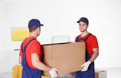 Furniture being loaded into a removals van for a Watford property