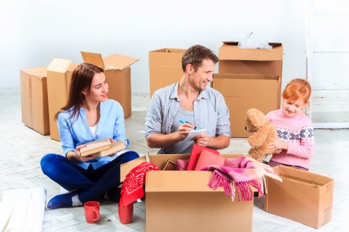 Professional movers loading items for a Watford relocation