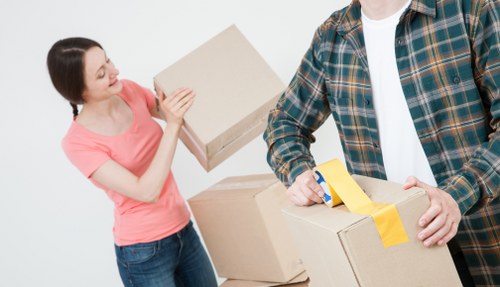 House removal team planning a move in Watford with boxes and furniture