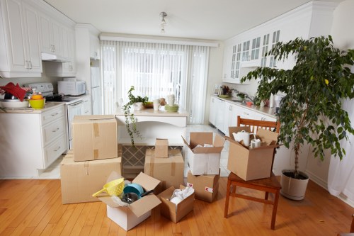 Removalists packing household items for a Watford home move